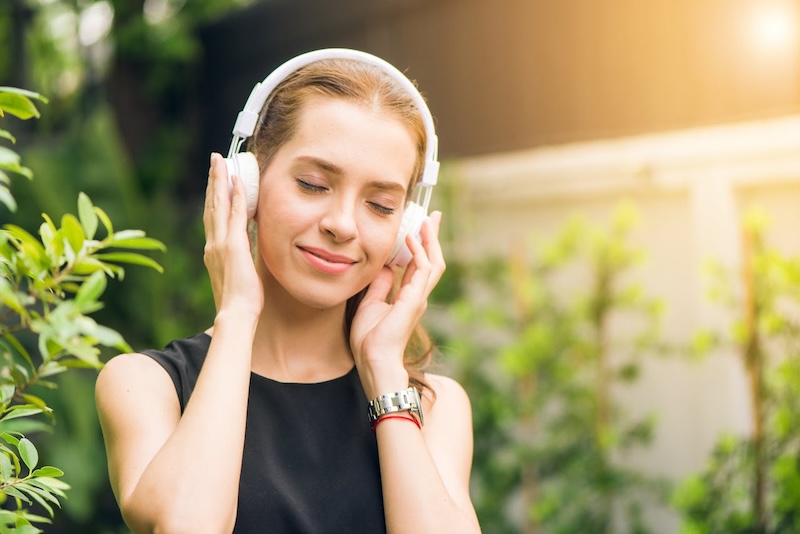 girl wearing noise-canceling headphones
